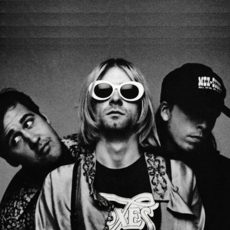 Foto do emoji da banda Nirvana com instrumentos em volta